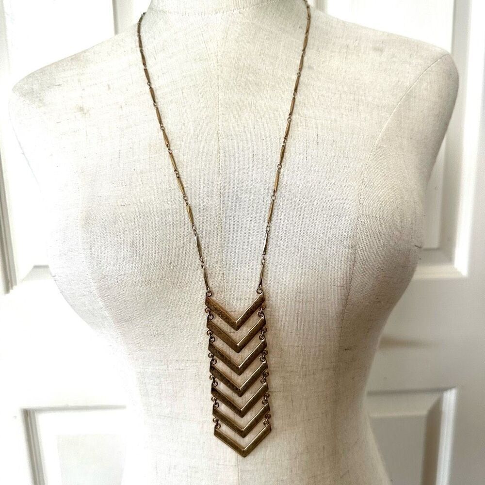 Gold tone long chevron pendant necklace